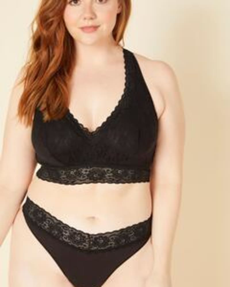Front of a model wearing a size 1X Lace Mid-Rise Thong in Black by Cosabella. | dia_product_style_image_id:253701